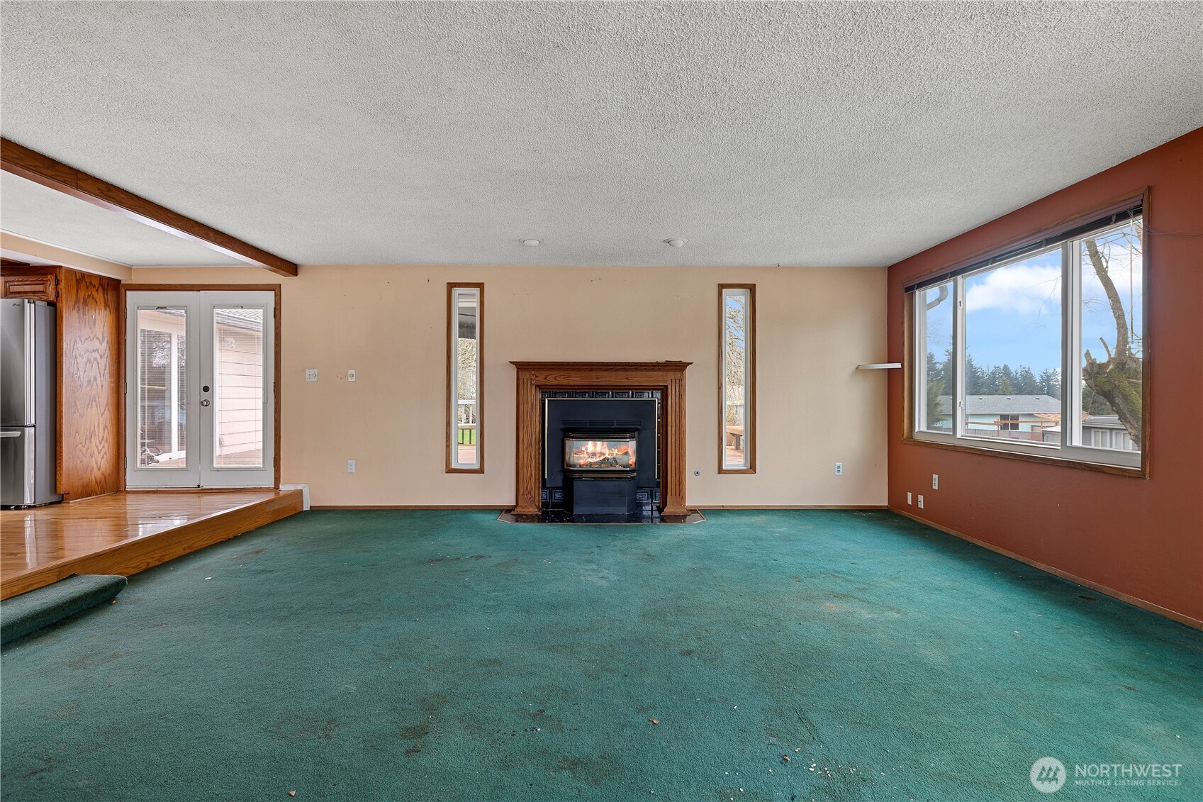 15 76th Street Southwest Everett, WA 98203 - Photo 9 of 39 a view of an empty room with window and fire place