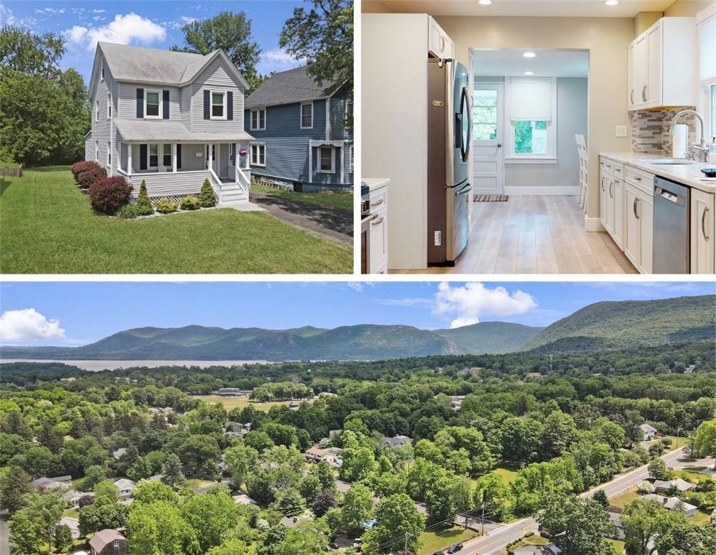 a view of an house with backyard space and balcony