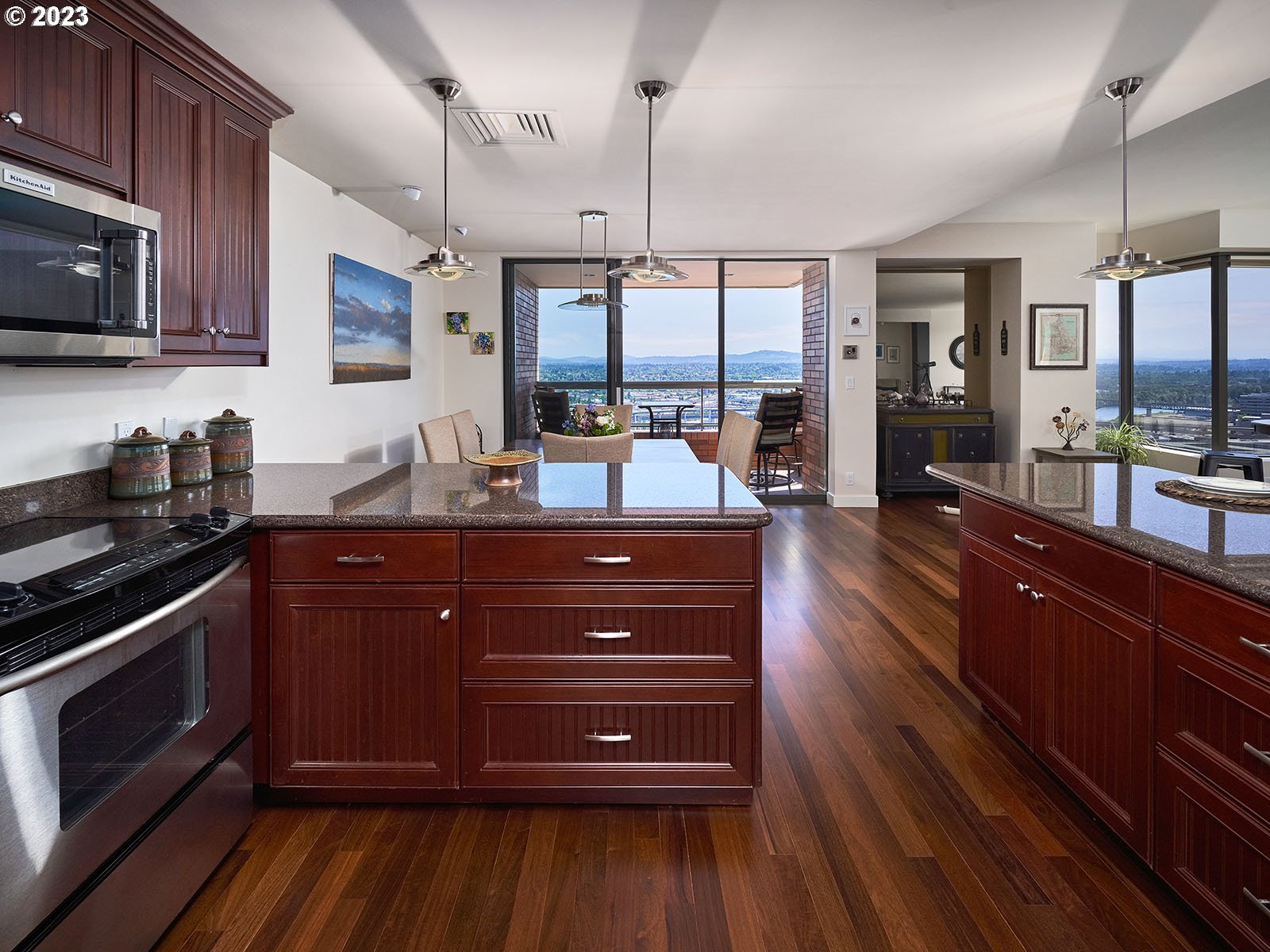 1414 Southwest 3rd Avenue, Unit 2502 Portland, OR 97201 - Photo 12 of 41 a kitchen with a sink stove and wooden floor