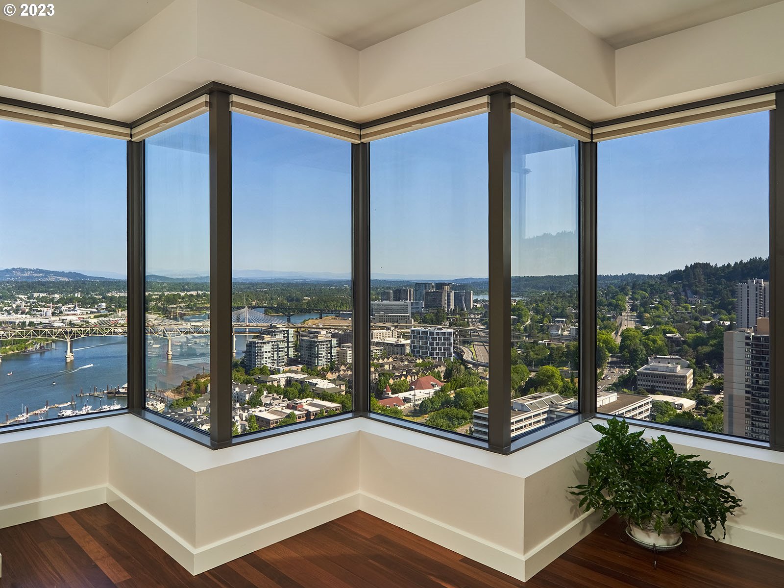 1414 Southwest 3rd Avenue, Unit 2502 Portland, OR 97201 - Photo 15 of 41 a view of a living room with a floor to ceiling window and an outdoor kitchen
