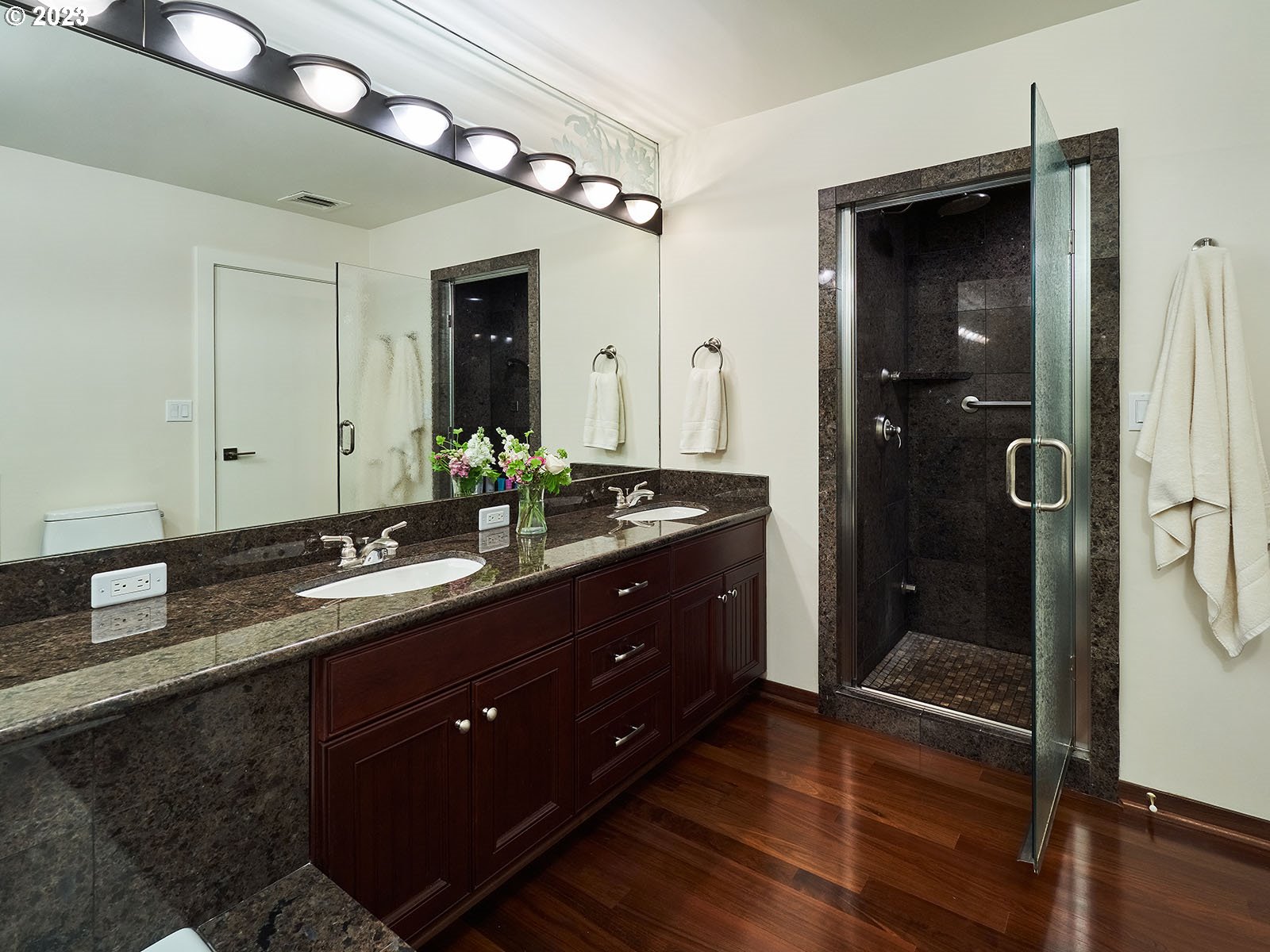 1414 Southwest 3rd Avenue, Unit 2502 Portland, OR 97201 - Photo 30 of 41 a bathroom with a granite countertop sink shower and a mirror