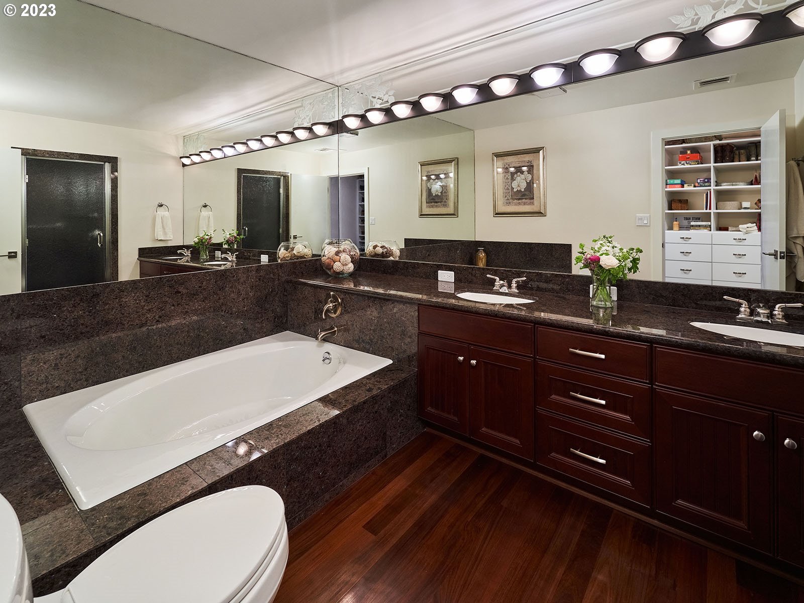 1414 Southwest 3rd Avenue, Unit 2502 Portland, OR 97201 - Photo 31 of 41 a large bathroom with a sink a toilet a mirror and a bathtub