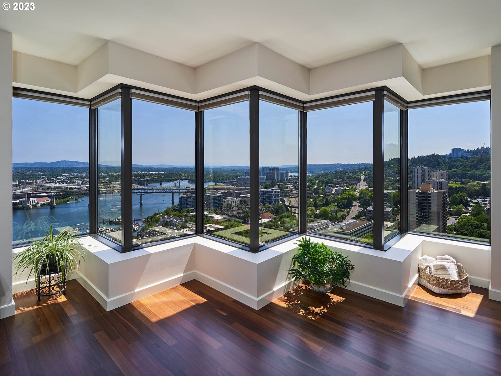 1414 Southwest 3rd Avenue, Unit 2502 Portland, OR 97201 - Photo 4 of 41 a living room with a large window and a wooden floor