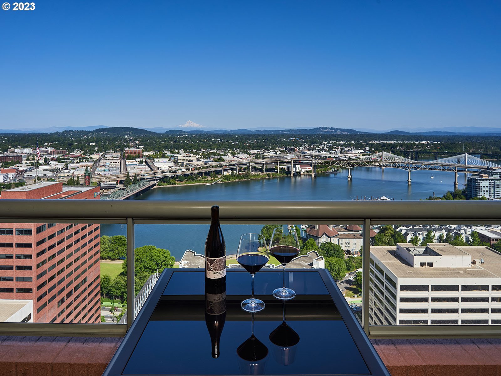 1414 Southwest 3rd Avenue, Unit 2502 Portland, OR 97201 - Photo 8 of 41 a view of a balcony with dining table and chairs