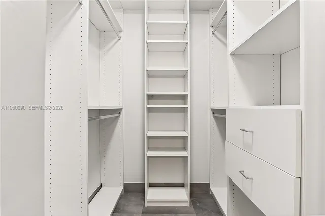 a bathroom with a sink vanity granite and a mirror