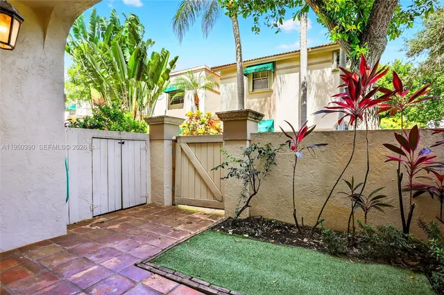 a view of a backyard with plants