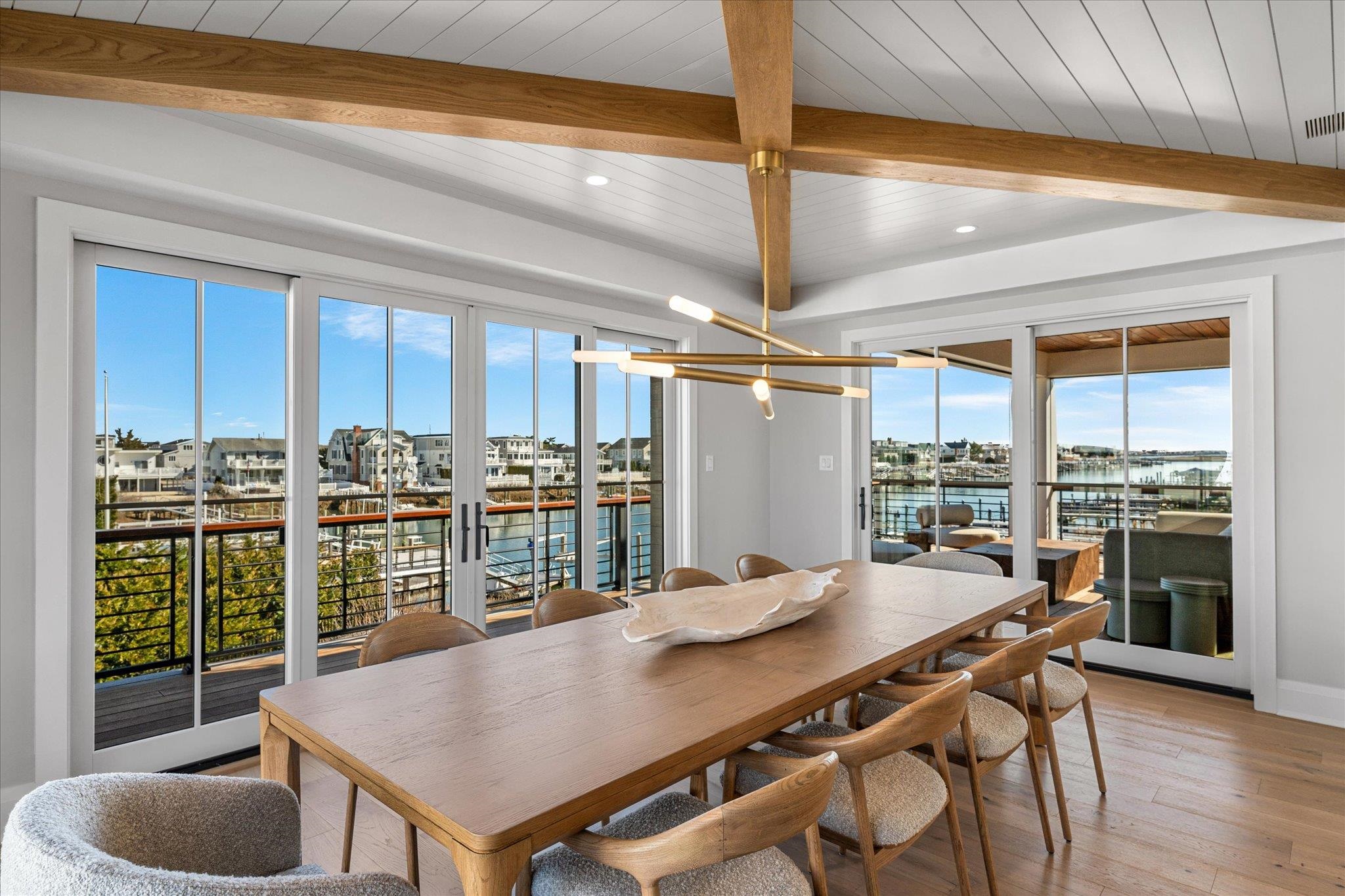 4277 5th Avenue Avalon, NJ 08202 - Photo 11 of 48 a view of a dining room with furniture and wooden floor