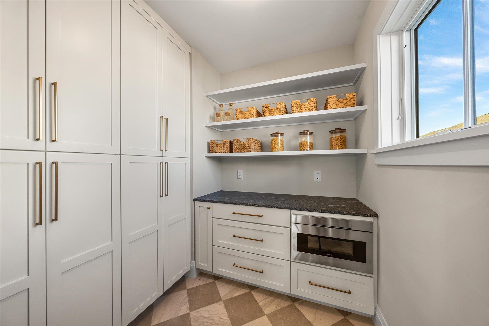 4277 5th Avenue Avalon, NJ 08202 - Photo 15 of 48 a kitchen with white cabinets and white appliances