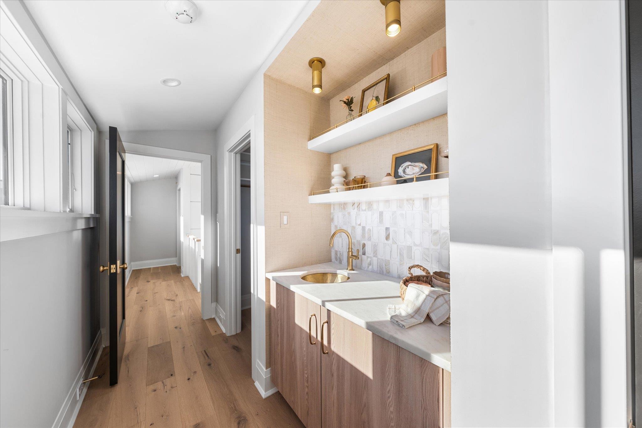 4277 5th Avenue Avalon, NJ 08202 - Photo 25 of 48 a kitchen with a sink and a refrigerator