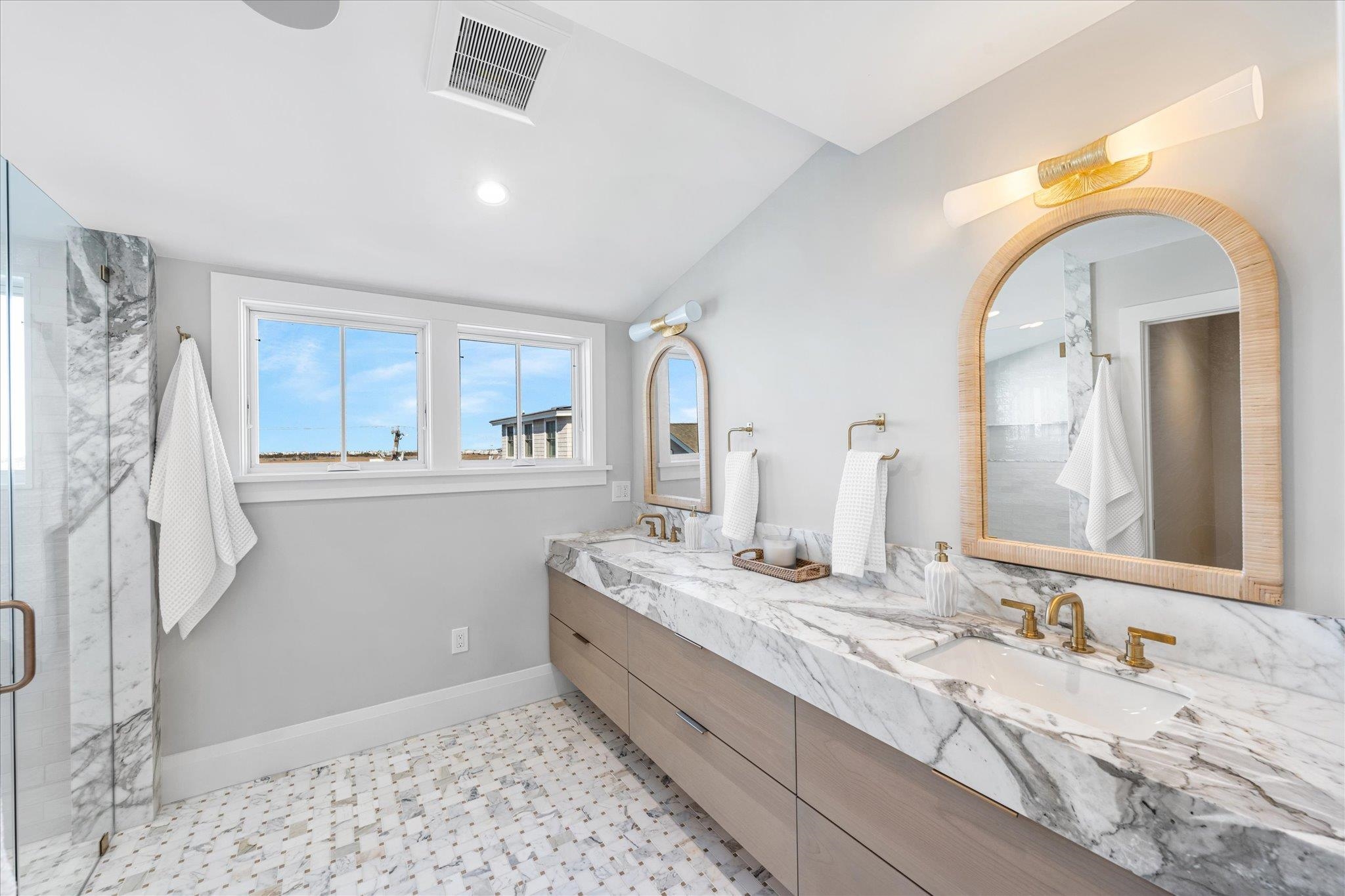 4277 5th Avenue Avalon, NJ 08202 - Photo 27 of 48 a spacious bathroom with a granite countertop sink and a mirror