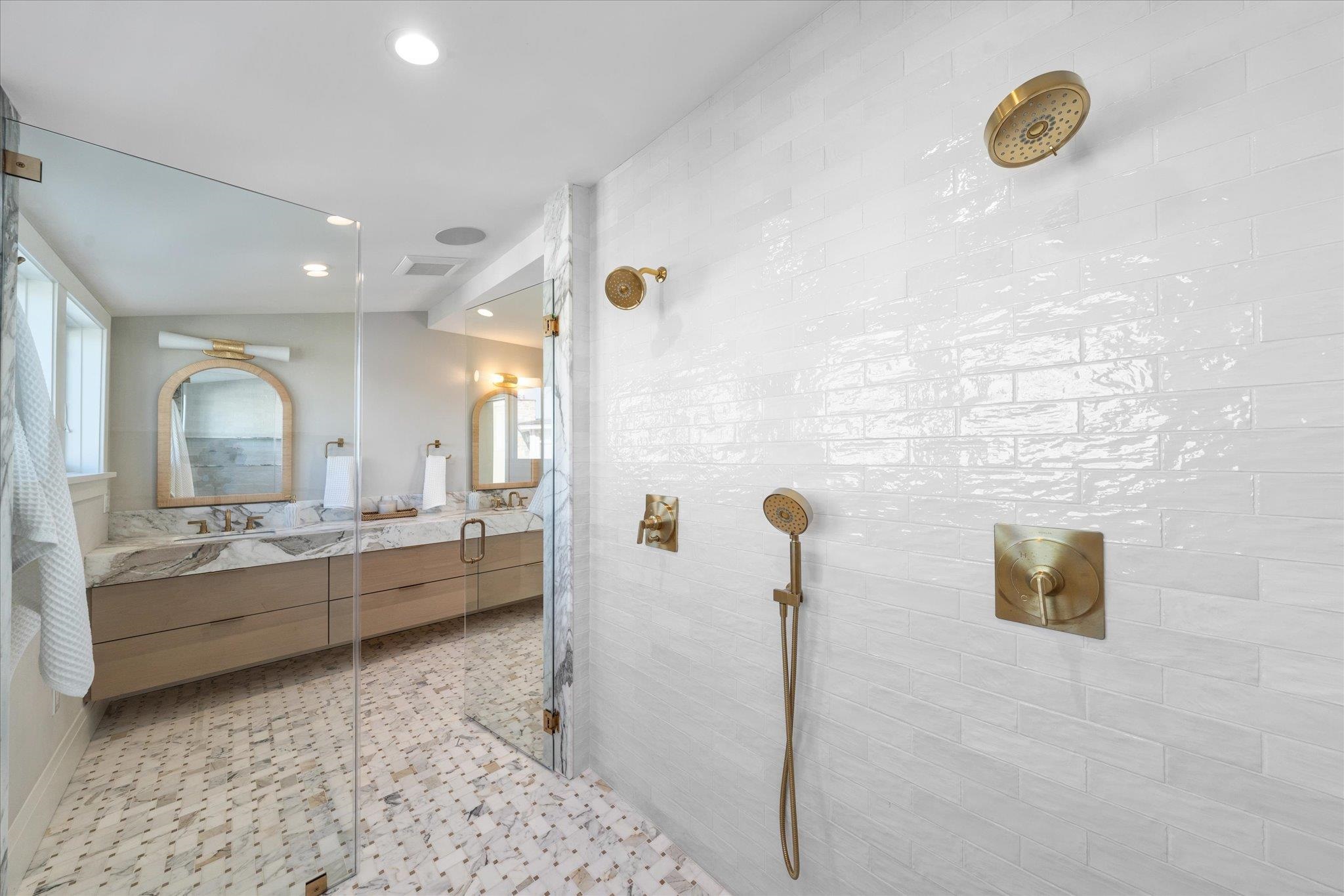 4277 5th Avenue Avalon, NJ 08202 - Photo 28 of 48 a bathroom with a tub sink and mirror