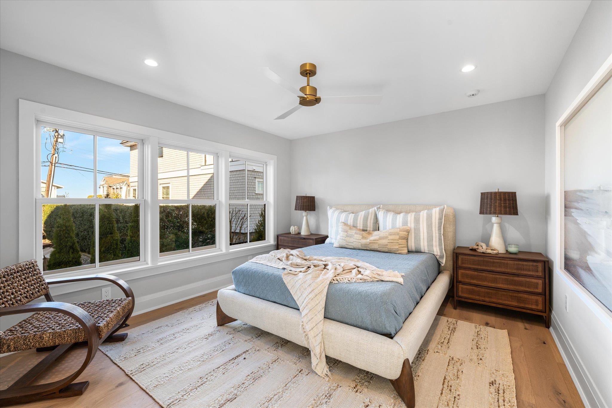 4277 5th Avenue Avalon, NJ 08202 - Photo 32 of 48 a bedroom with a large bed and a large window