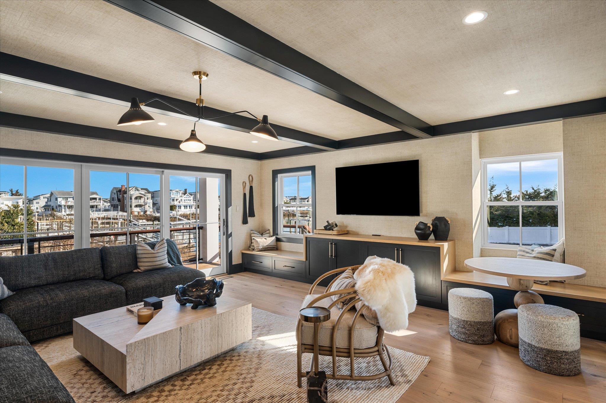 4277 5th Avenue Avalon, NJ 08202 - Photo 33 of 48 a living room with furniture and a flat screen tv