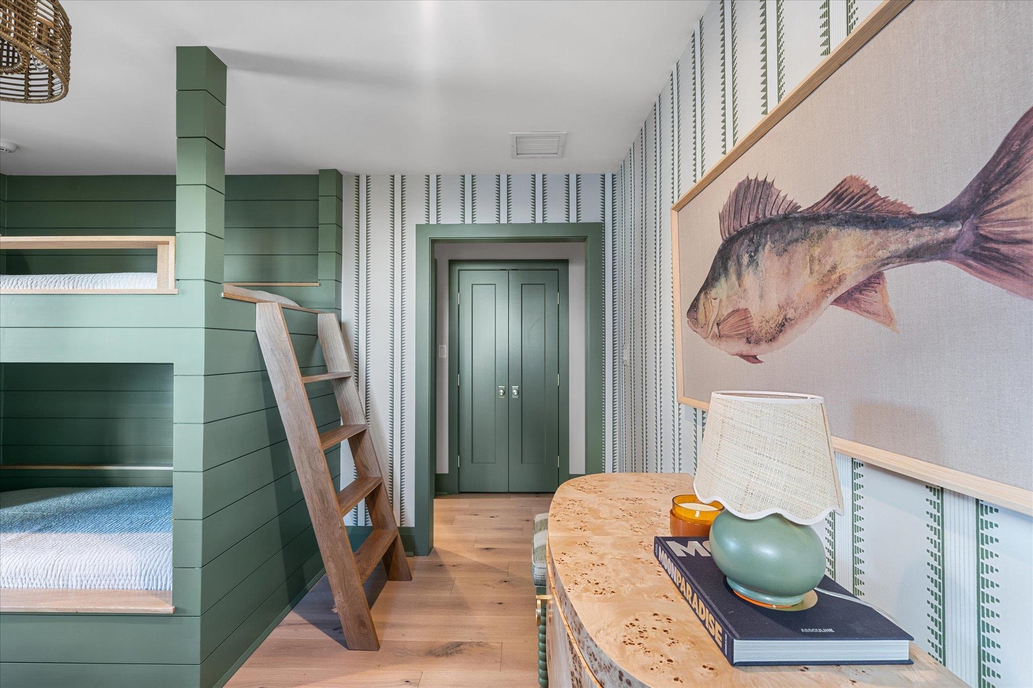 4277 5th Avenue Avalon, NJ 08202 - Photo 36 of 48 a bedroom with a bed and a mirror