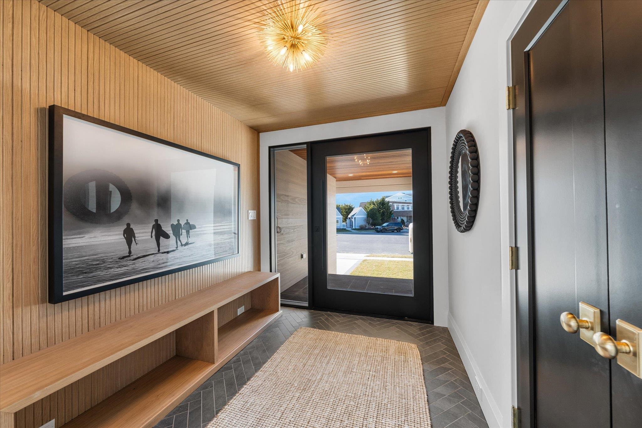 4277 5th Avenue Avalon, NJ 08202 - Photo 45 of 48 a view of a hallway with wooden floor and a bathroom