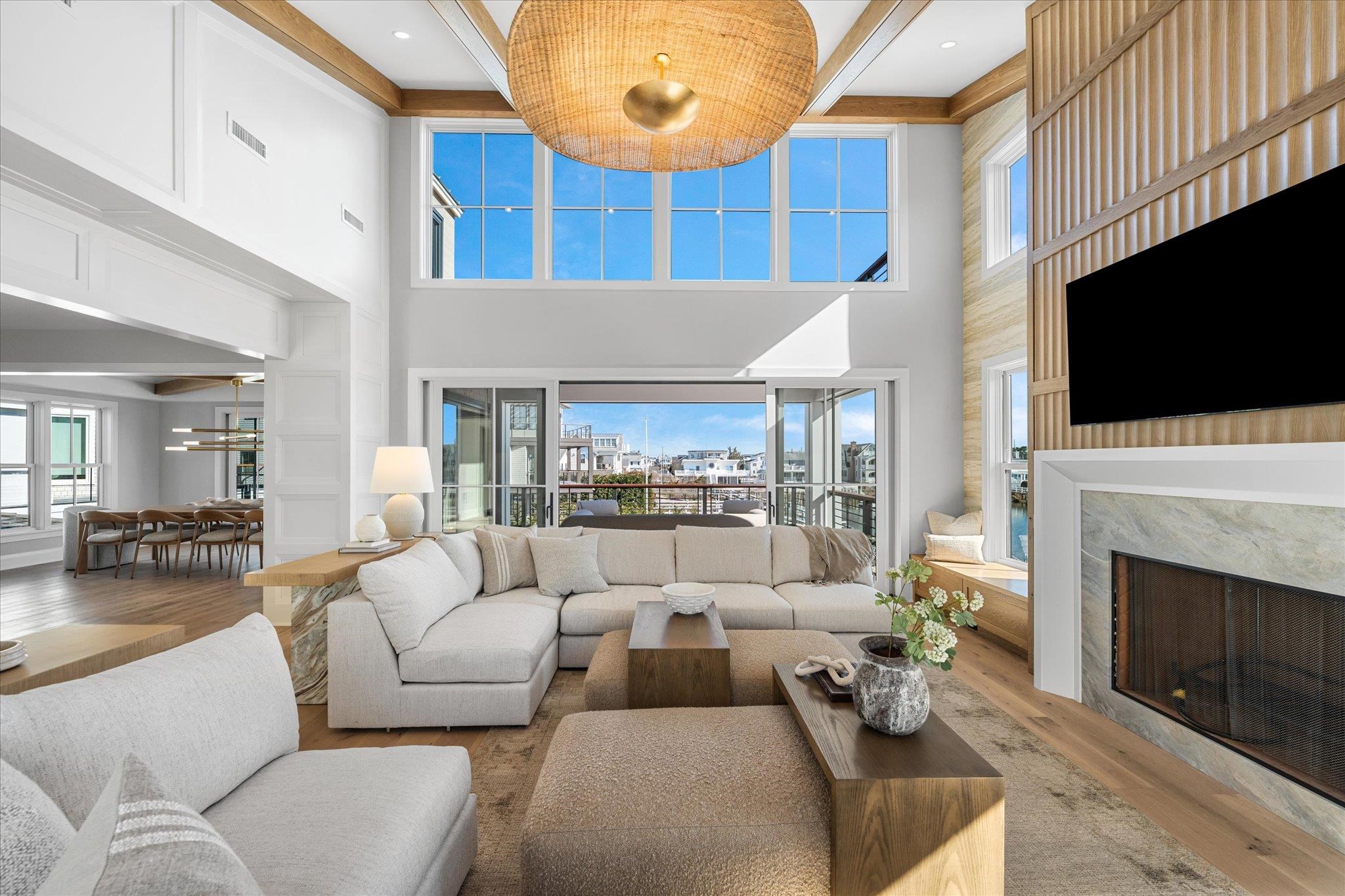 4277 5th Avenue Avalon, NJ 08202 - Photo 8 of 48 a living room with furniture a fireplace and a flat screen tv
