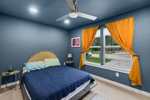 a bedroom with a bed and a window