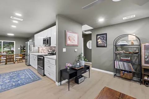 a living room with fireplace furniture and decor