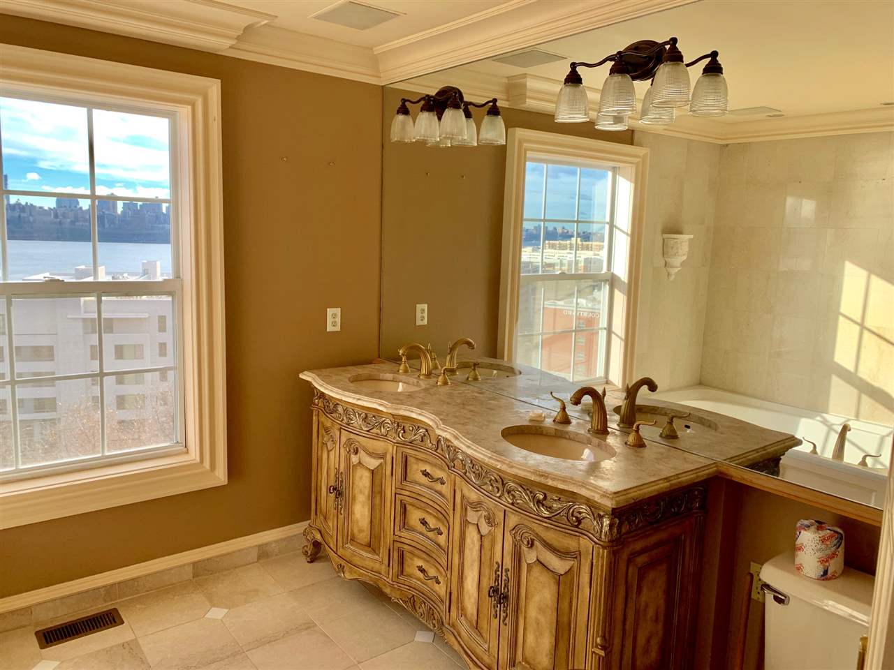 54 Bergen Ridge Road, Unit 1 North Bergen, NJ 07047 - Photo 14 of 16 a bathroom with a double vanity sink and a mirror