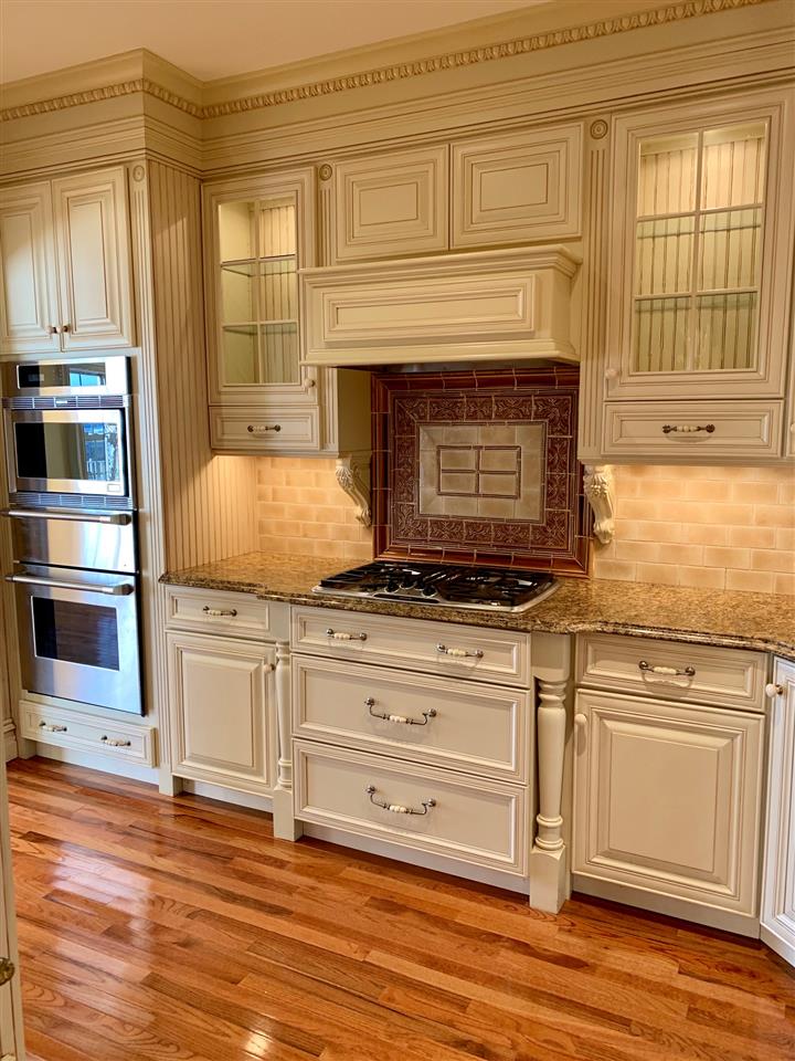 54 Bergen Ridge Road, Unit 1 North Bergen, NJ 07047 - Photo 4 of 16 a kitchen with granite countertop cabinets stainless steel appliances and a fireplace