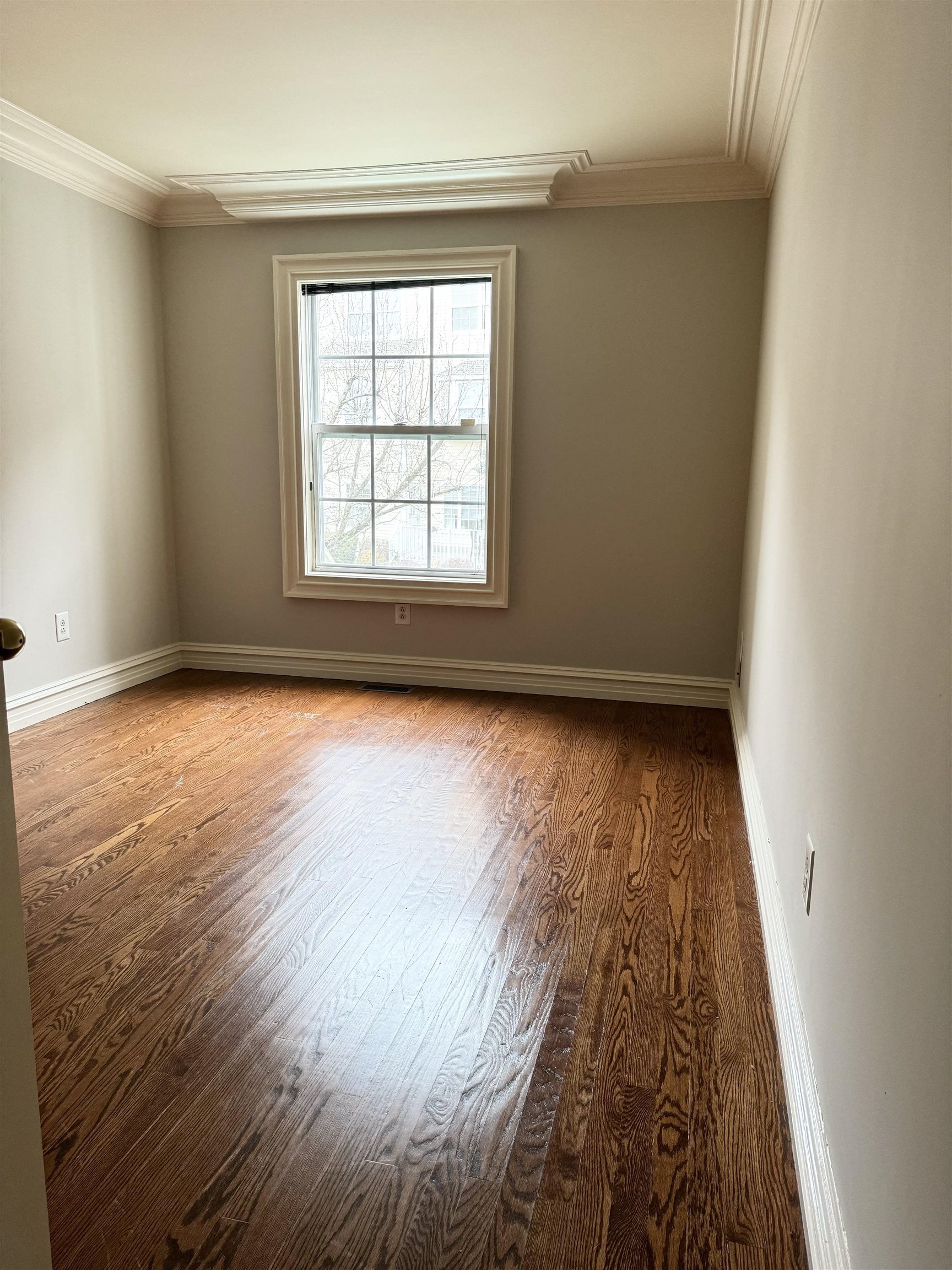 54 Bergen Ridge Road, Unit 1 North Bergen, NJ 07047 - Photo 9 of 16 an empty room with wooden floor and windows