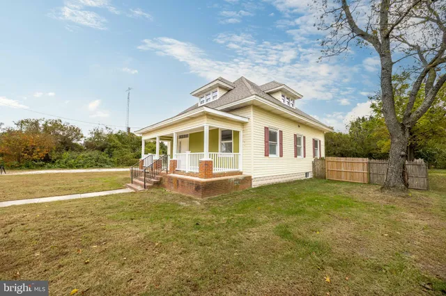 a front view of a house with parking space