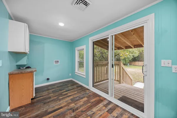 an empty room with windows and natural light