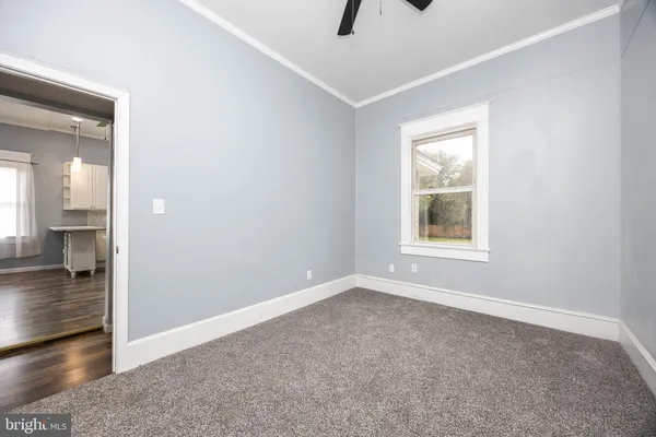 a view of an empty room with a window