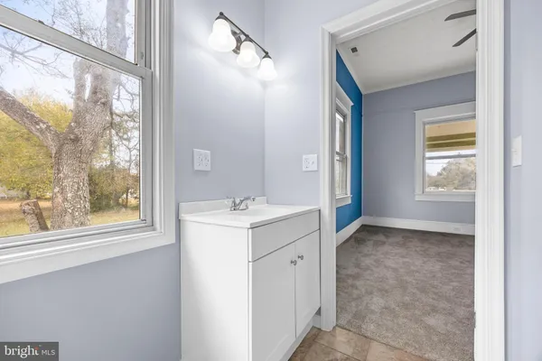 a view of an empty room with closet