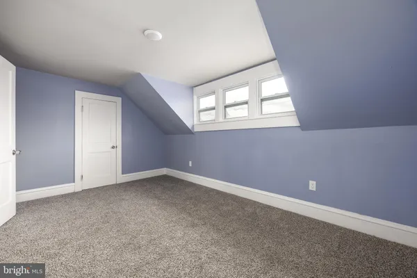 a white toilet sitting next to a shower