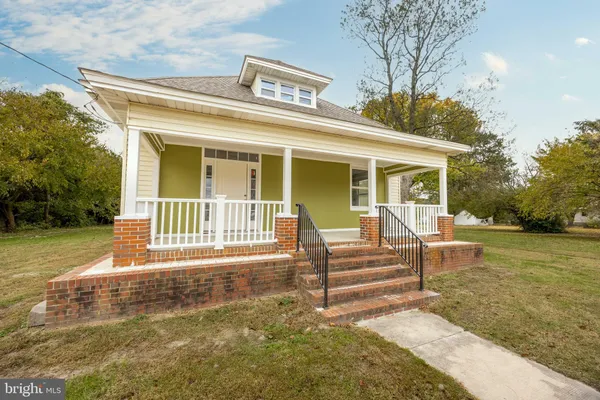 a front view of a house with parking space