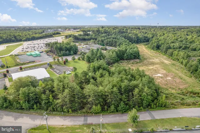 a view of a lake with houses in the back