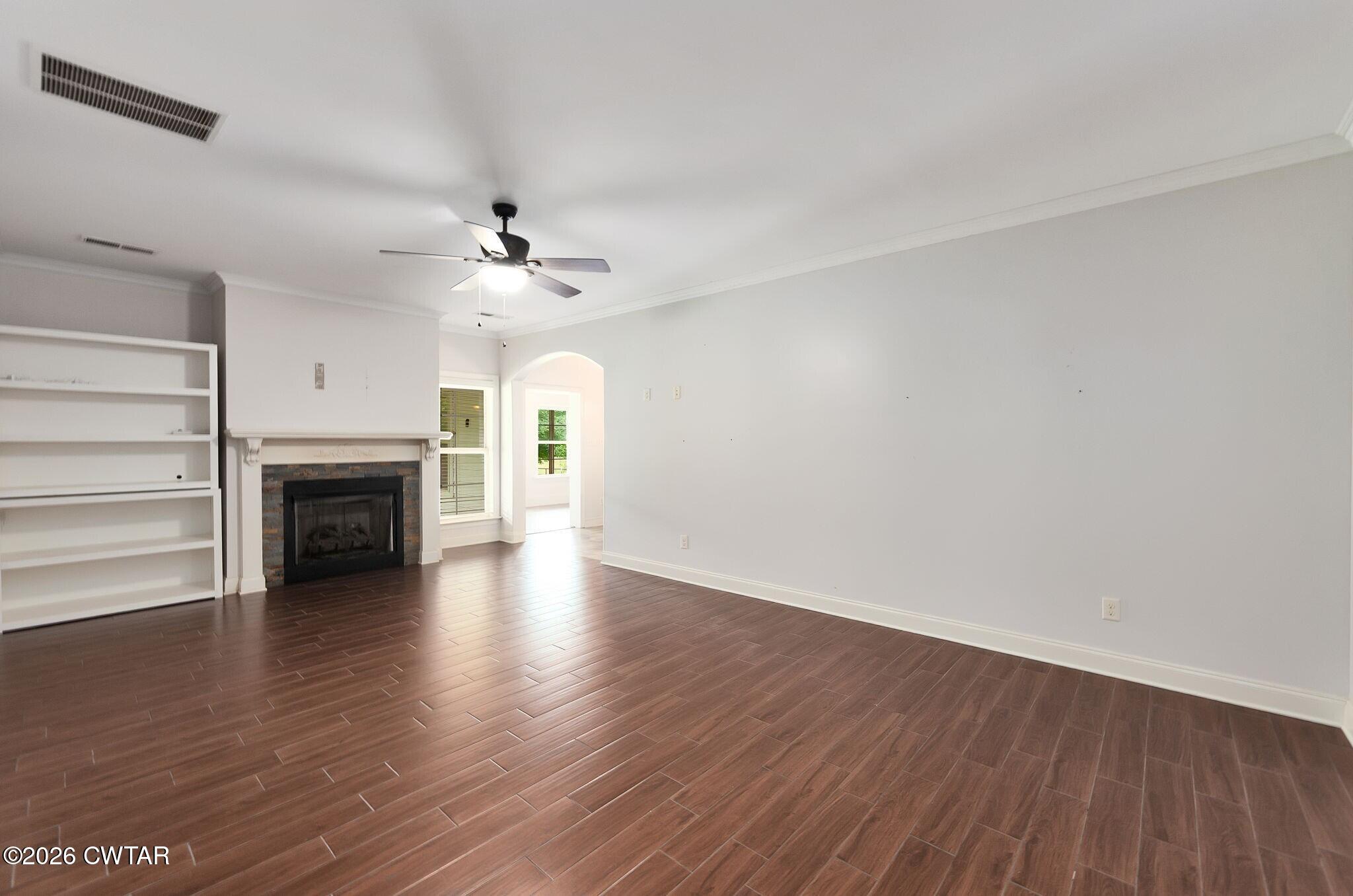 4080 Beech Bluff Road Beech Bluff, TN 38313 - Photo 23 of 41 a view of a livingroom with wooden floor a fireplace and a window