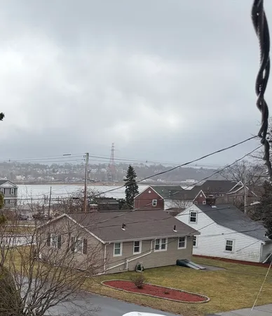 a view of a town with big building in front of it