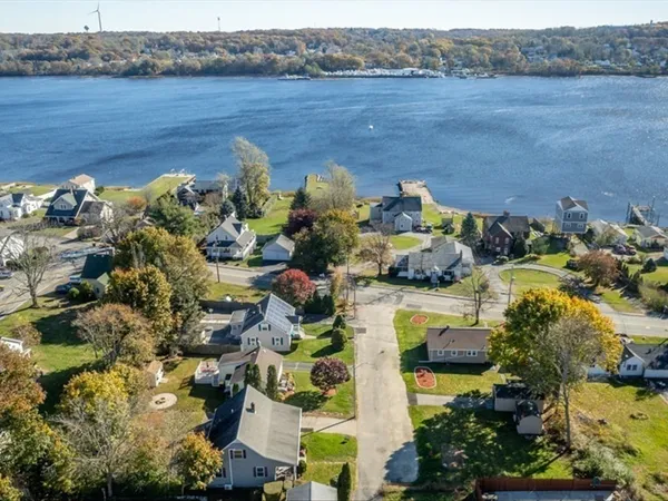 an aerial view of a house with a lake view