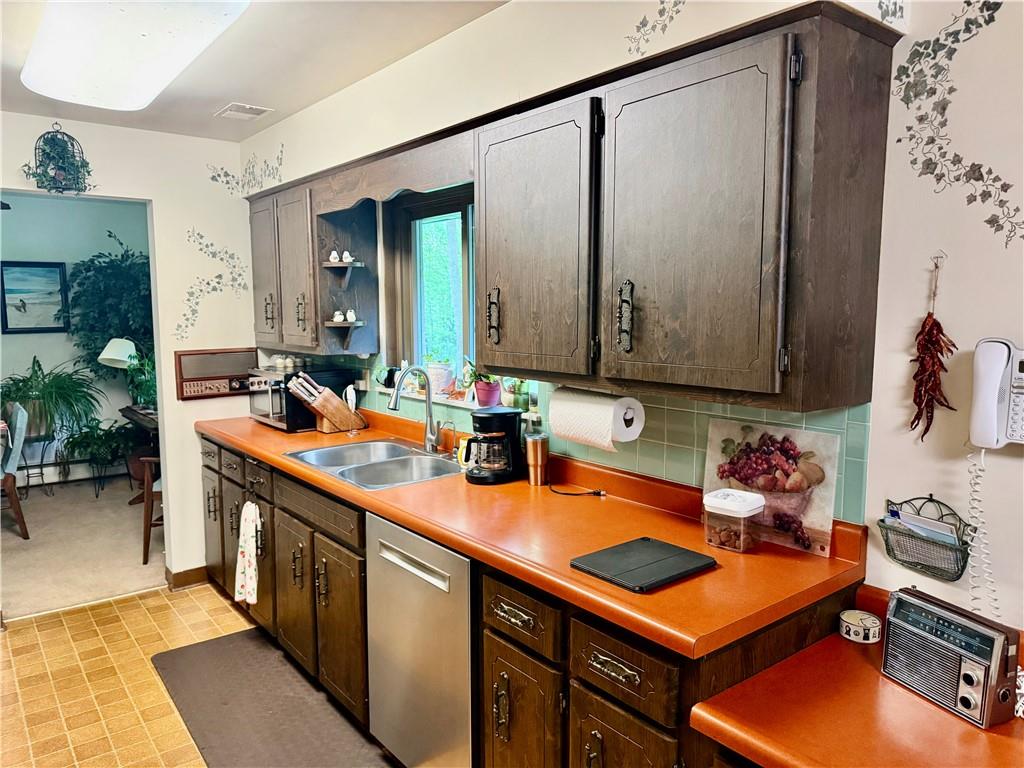 320 Saxonburg Road Butler, PA 16002 - Photo 8 of 36 a kitchen with a sink stove and cabinets