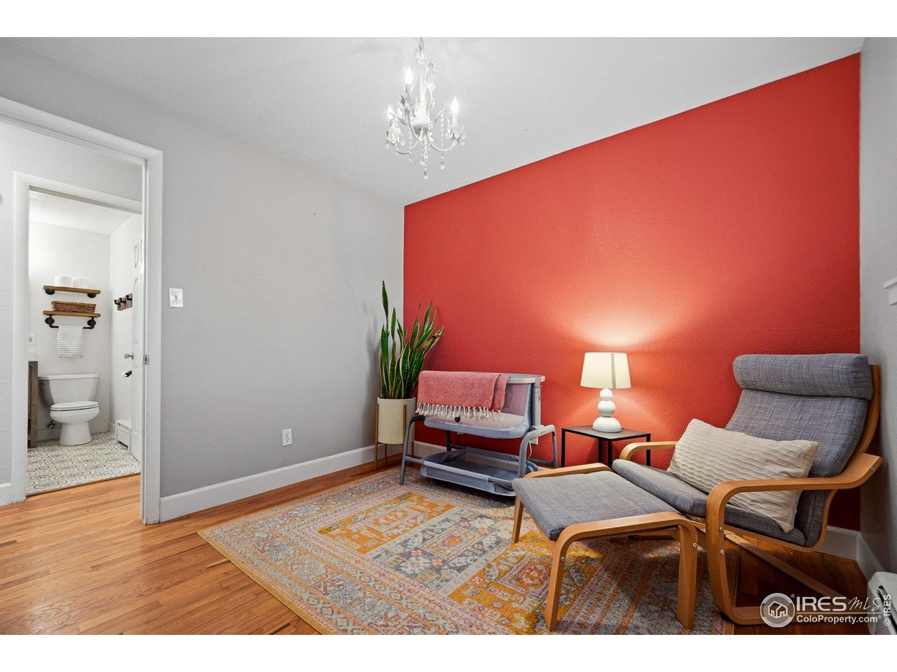 6034 South Steele Street Centennial, CO 80121 - Photo 11 of 46 a living room with furniture and a chandelier