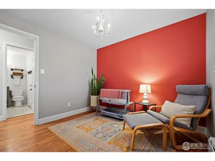 a spacious bedroom with a bed and a table