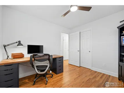 a workspace with furniture and wooden floor