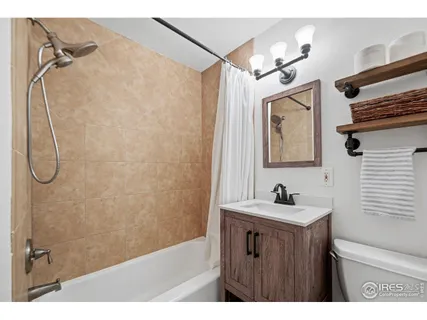 a bathroom with a sink a mirror and shower