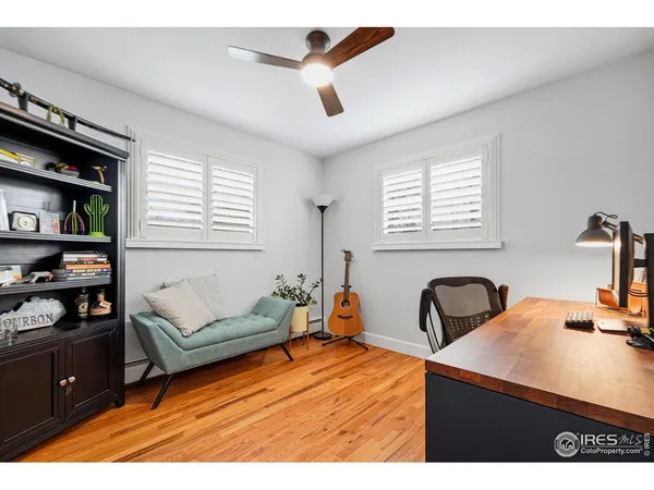 a workspace with furniture and wooden floor