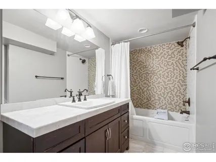 a outdoor living space with patio furniture and a fireplace