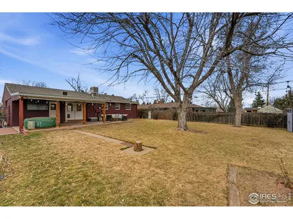 a view of a street with and parked cars
