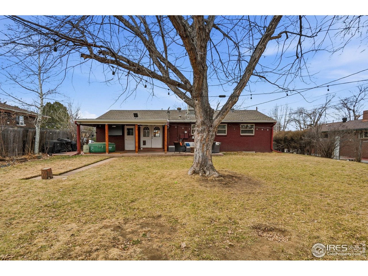 6034 South Steele Street Centennial, CO 80121 - Photo 36 of 46 a house view with a swimming pool