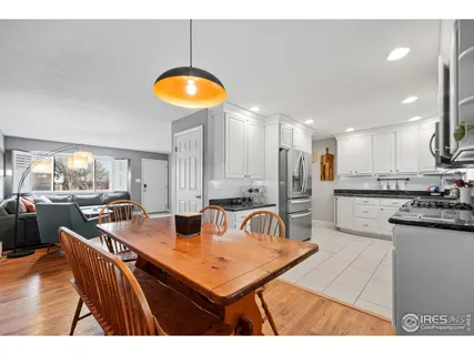 a kitchen with stainless steel appliances granite countertop a refrigerator stove microwave and sink