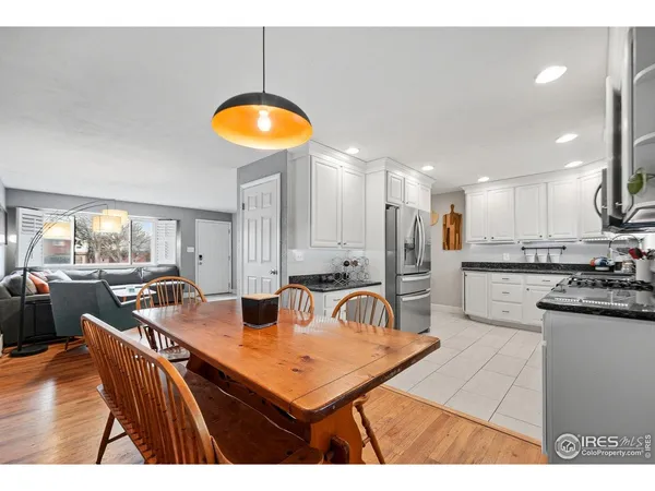 a kitchen with stainless steel appliances granite countertop a refrigerator stove microwave and sink