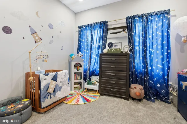 a view of a hallway with washer and dryer