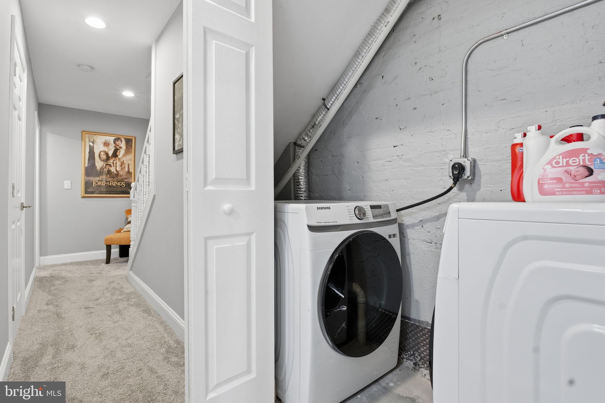 236 South Clinton Street Baltimore, MD 21224 - Photo 20 of 34 a view of a hallway with washer and dryer