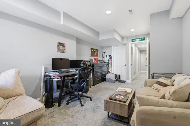 a view of a house with a yard and wooden fence