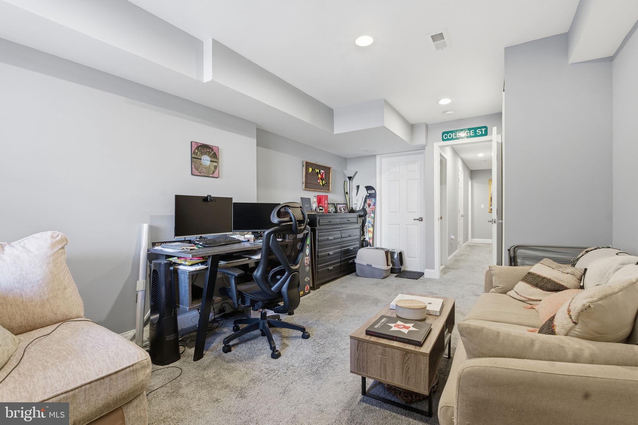 236 South Clinton Street Baltimore, MD 21224 - Photo 23 of 34 a living room with furniture and a wooden floor